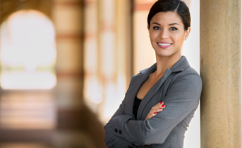 business woman smiling with arms crossed