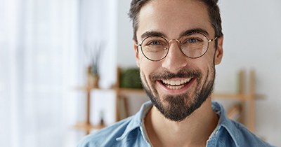 Man with dental bonding in Grafton smiles