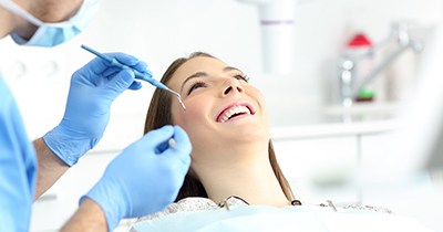 Woman visiting her dentist for dental bonding in Grafton
