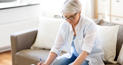 Woman looking to see does dental insurance cover dentures in Grafton