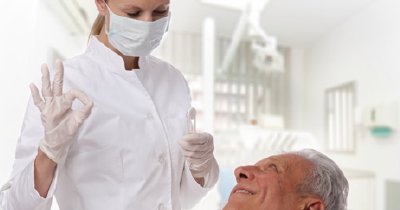 Smiling older man in dental chair