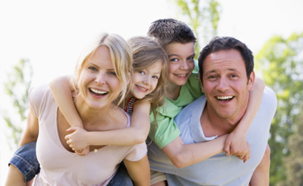 Smiling family outdoors