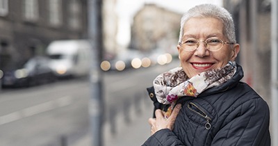 Woman smiling with dental implants in Grafton