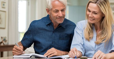 Older man and woman reviewing documents