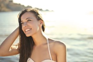 Woman with an attractive smile at the beach