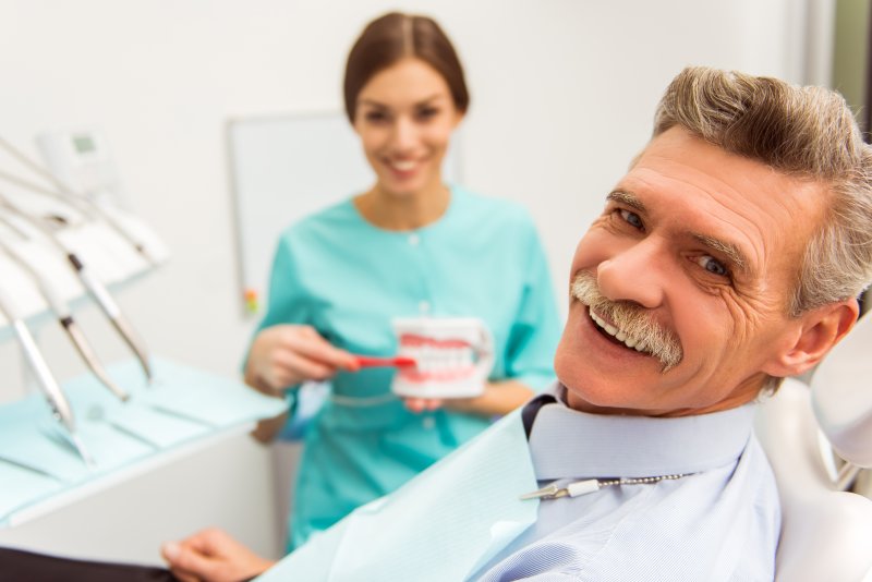 Smiling person with dentures