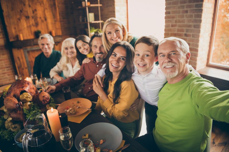 A family celebrating Thanksgiving with good oral health