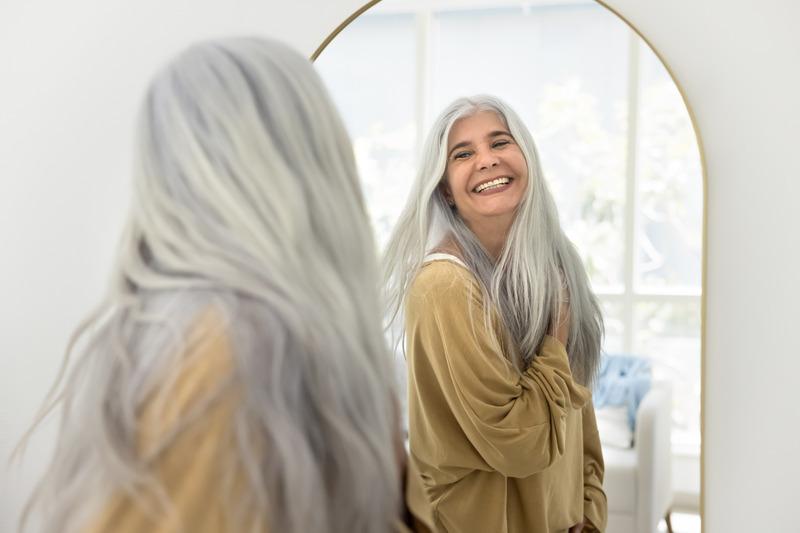 Patient smiling after getting porcelain veneers